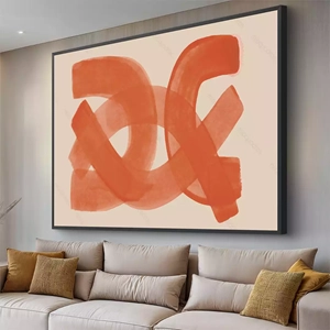 Quadro Boho Entrelaçamento Vibrante em Tons Quentes deitado sobre a superfície, mostrando os detalhes da moldura inferior direita.