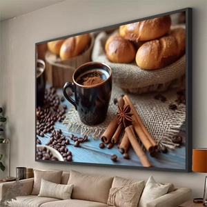 Quadro Café dos Prazeres Com Canela Aromática deitado sobre a superfície, mostrando os detalhes da moldura inferior direita.