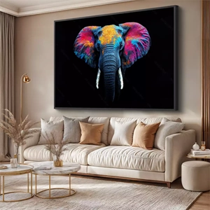 Quadro Elefante Cósmico Pintado em Cores Vivas deitado sobre a superfície, mostrando os detalhes da moldura inferior direita.