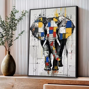 Quadro Elefante Geométrico em Vibração Cromática Moderna deitado sobre a superfície, mostrando os detalhes da moldura inferior direita.