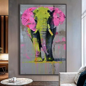Quadro Elefante Luminoso em Cores Neon Vibrantes deitado sobre a superfície, mostrando os detalhes da moldura inferior direita.