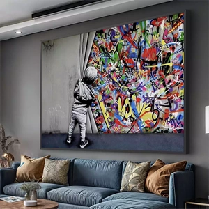 Quadro Grafite Revelando o Mundo das Cores deitado sobre a superfície, mostrando os detalhes da moldura inferior direita.