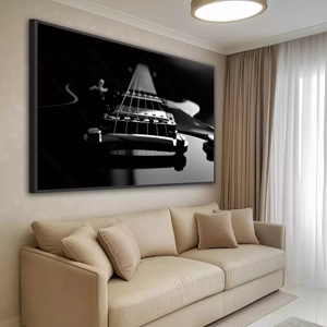 Quadro Guitarra Preto e Branco deitado sobre a superfície, mostrando os detalhes da moldura inferior direita.