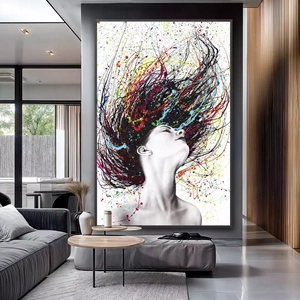Quadro Mulher Abstrata das Cores em Explosão deitado sobre a superfície, mostrando os detalhes da moldura inferior direita.