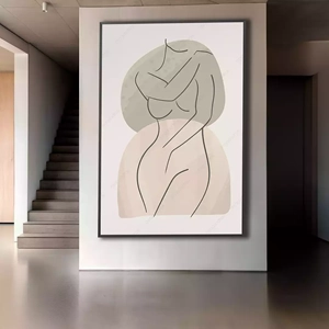 Quadro Mulher Abstrata em Curvas e Tons Suaves deitado sobre a superfície, mostrando os detalhes da moldura inferior direita.