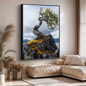 Quadro Natureza Resiliente em Escarpas Desafiadoras e Solitárias deitado sobre a superfície, mostrando os detalhes da moldura inferior direita.