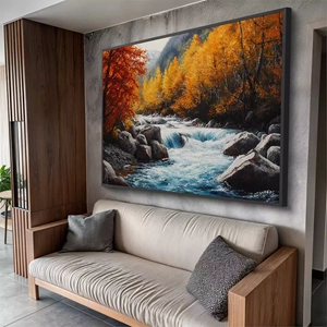 Quadro Natureza Viva das Águas em Outono Dourado deitado sobre a superfície, mostrando os detalhes da moldura inferior direita.