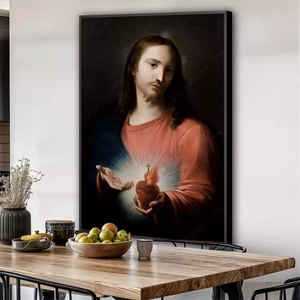 Quadro Sagrado Coração de Jesus deitado sobre a superfície, mostrando os detalhes da moldura inferior direita.