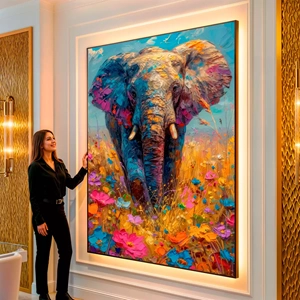 Quadro Elefante em Harmonia Com Flores Vivas visto de frente, exibindo sua moldura e sua arte.