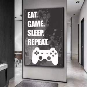 Ambiente decorado com um quadro pendurado na parede que retrata Gamer Lifestyle - Eat, Game, Sleep, Repeat